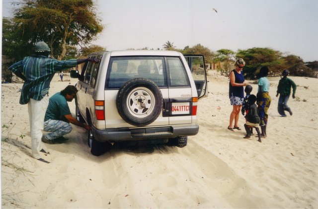 Pierre Reynaud of IRD letting air out of tires for better traction in the sand on Mboro Beach